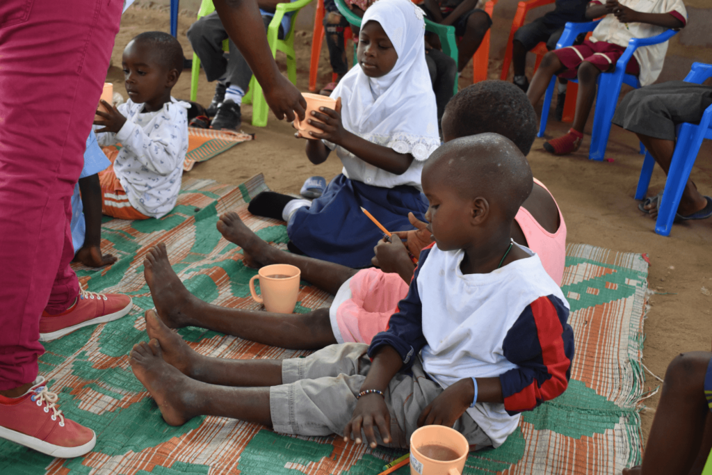 Tanzania school children eating at school - Africa