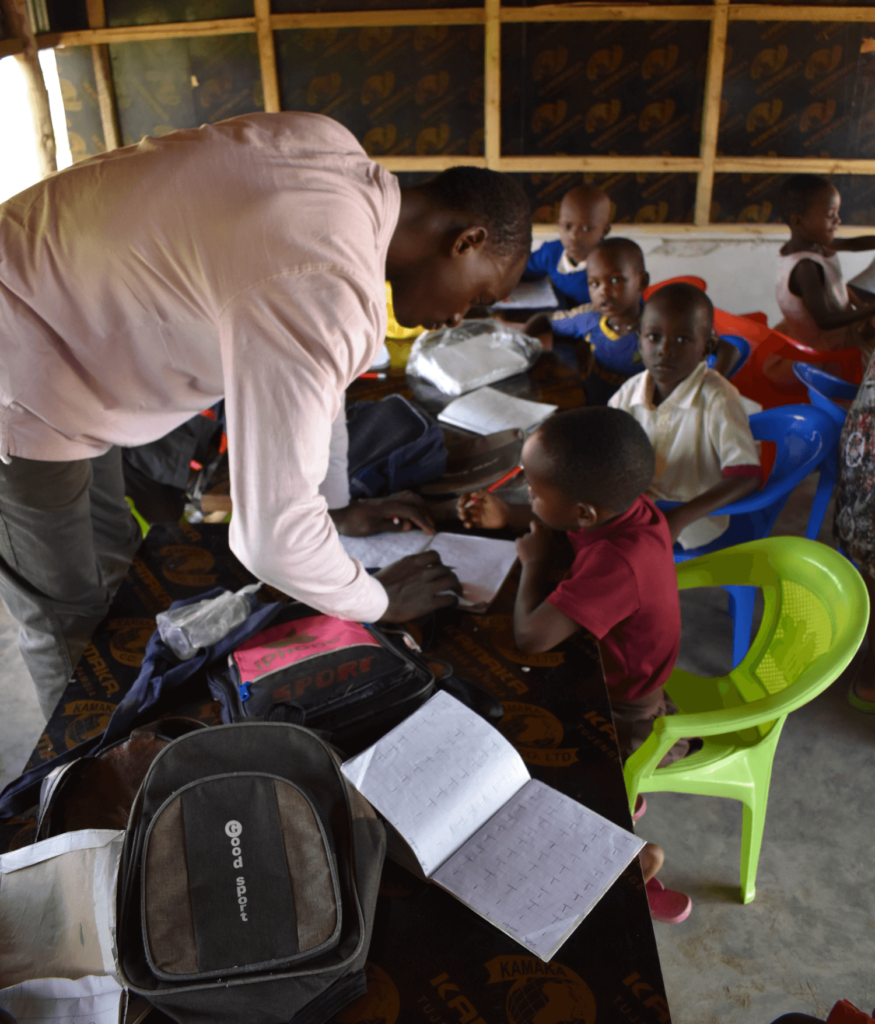 Tanzania teacher with students