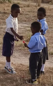 Tanzania children collecting plastic bottles
